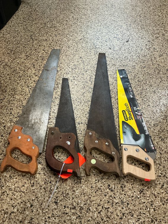 Grouping of 4 hand saws with wood handles