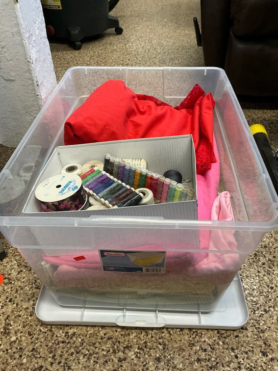 Storage tote with fabric remnants & sewing thread