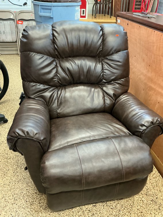 Brown upholstered manual recliner chair