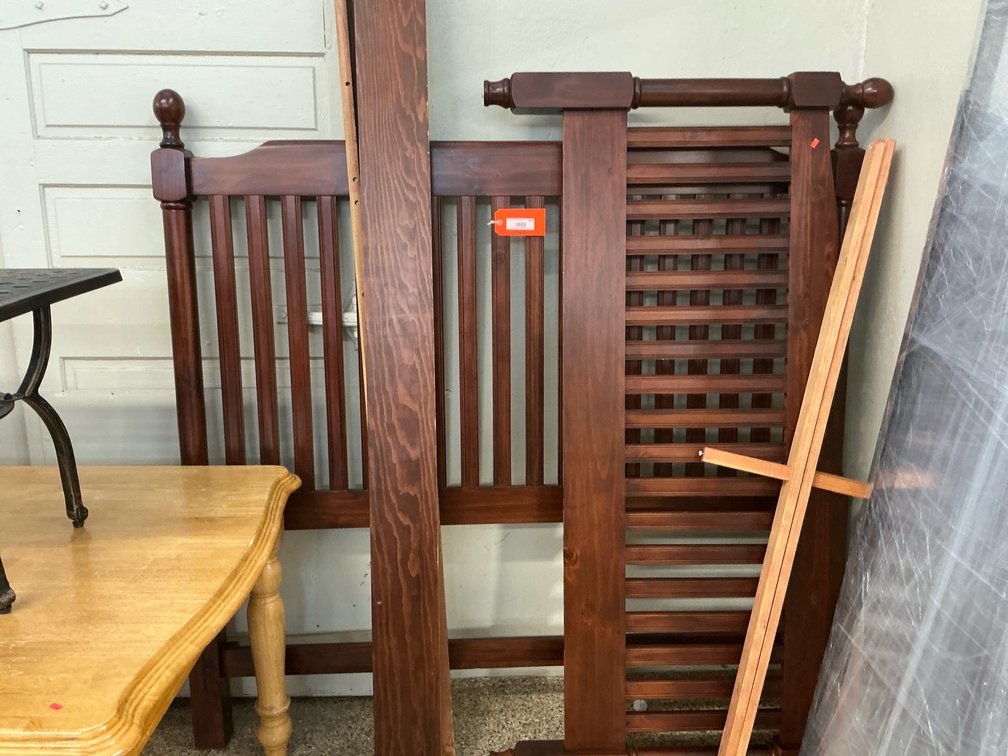 Queen size dark stained wood slatted bed frame with turned finials