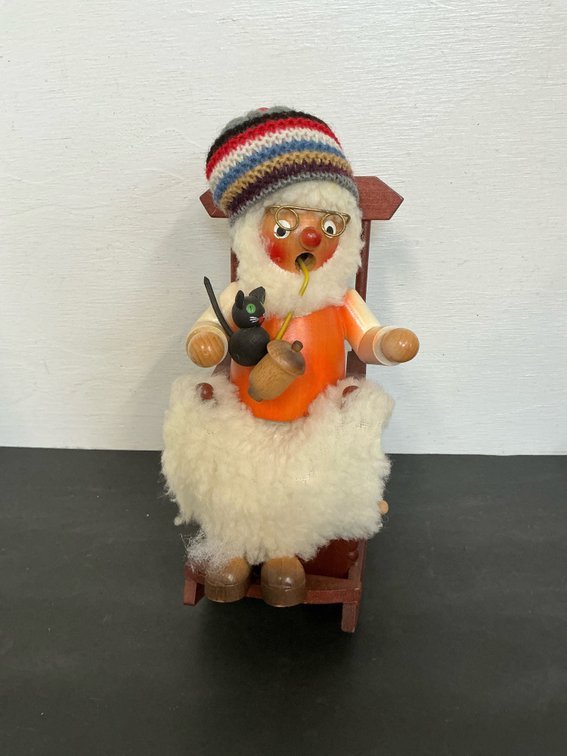 Steinbach wooden smoker in rocking chair with cat