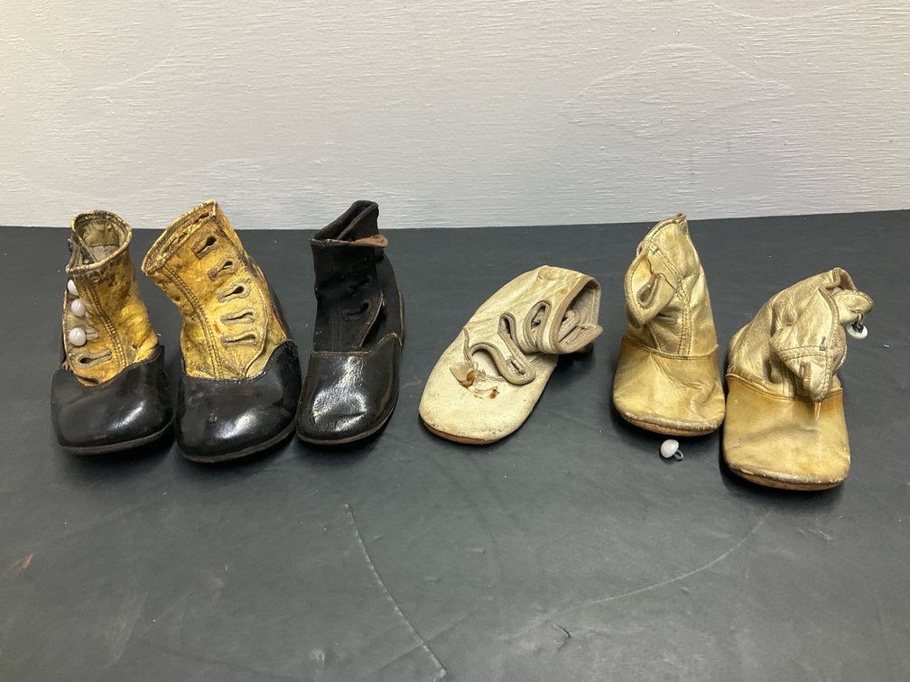 Grouping of leather infant & doll shoes