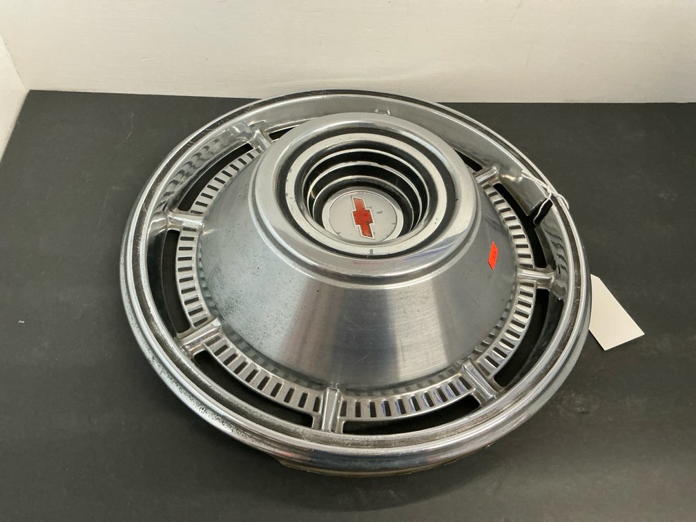 Chevrolet chrome hubcap with red bowtie emblem