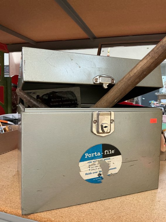 Gray metal file box with folding shovel, tools & hardware