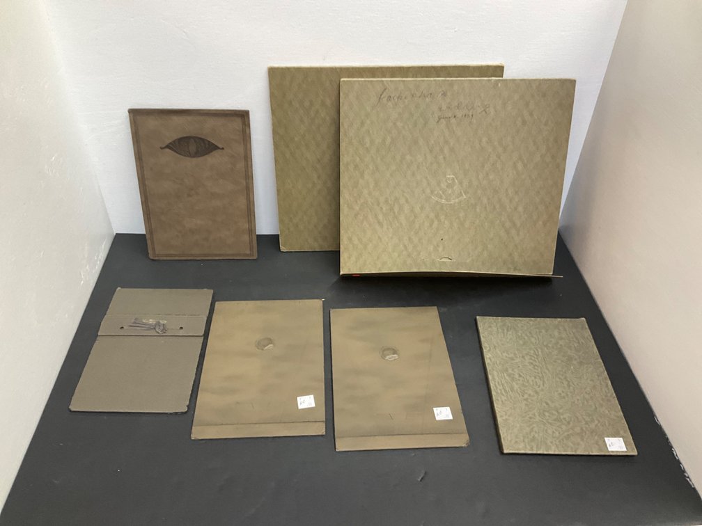 Studio portrait photographs in cardboard folders