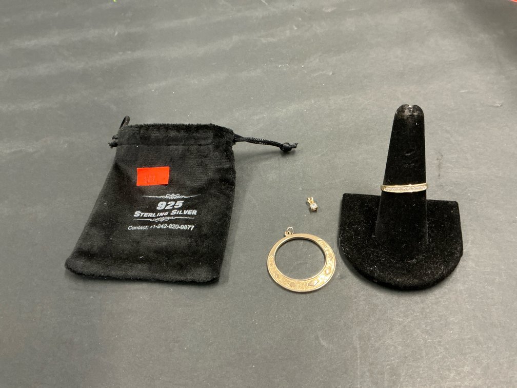 Grouping of 3 gold-tone jewelry pieces & pouch