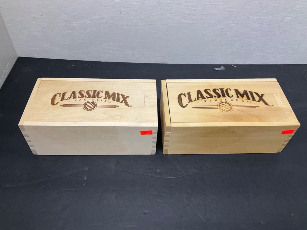 Pair of Classic Mix Partners LLC wooden slide-lid boxes