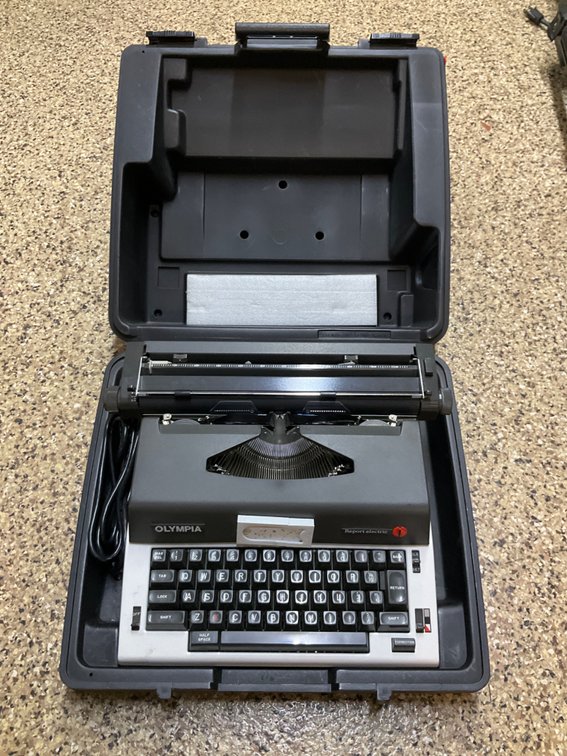 Olympia Report electric typewriter with hard case