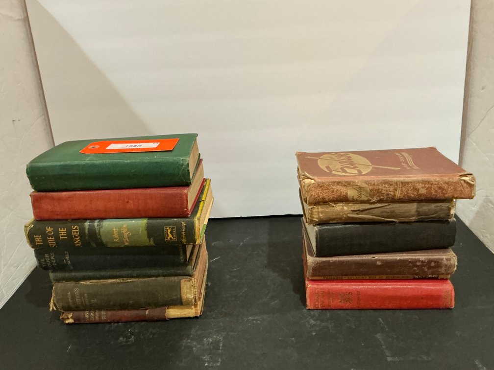 Grouping of cloth-bound hardcover books - Office Main Level
