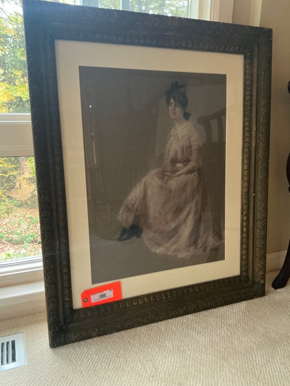 Framed portrait of a seated woman in ornate frame - Den Main Level