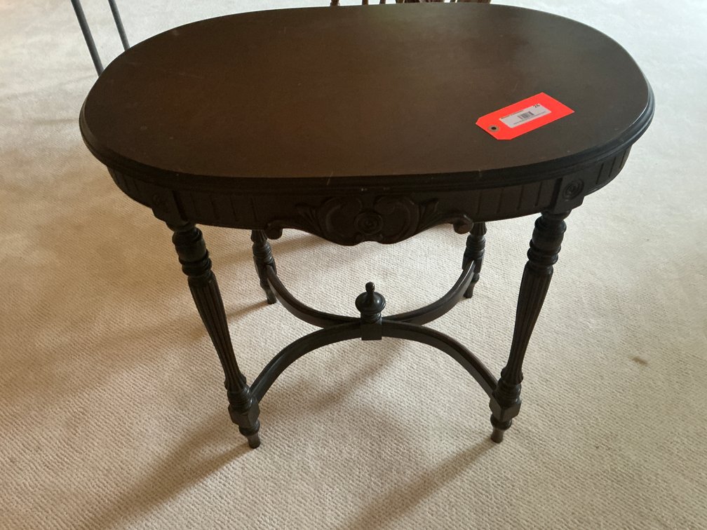 Oval dark wood accent table with X-stretcher - Den Main Level