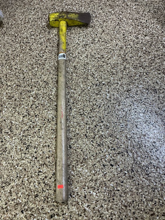 Splitting maul with yellow head and wooden handle