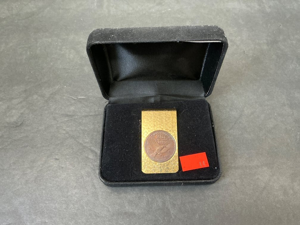 Gold-tone money clip with .999 fine silver medallion