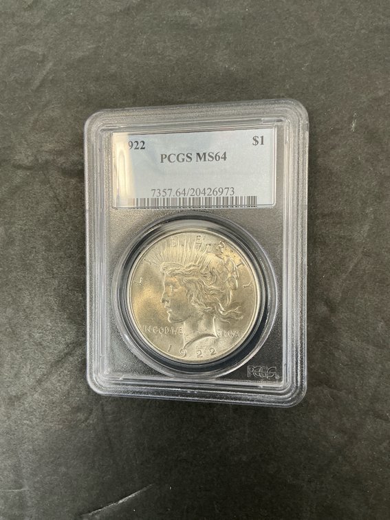 1922 Peace silver dollar in PCGS MS64 holder