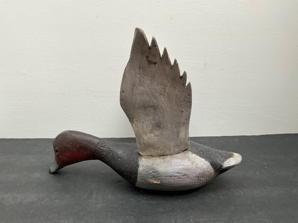 Carved wood flying duck decoy with raised wings