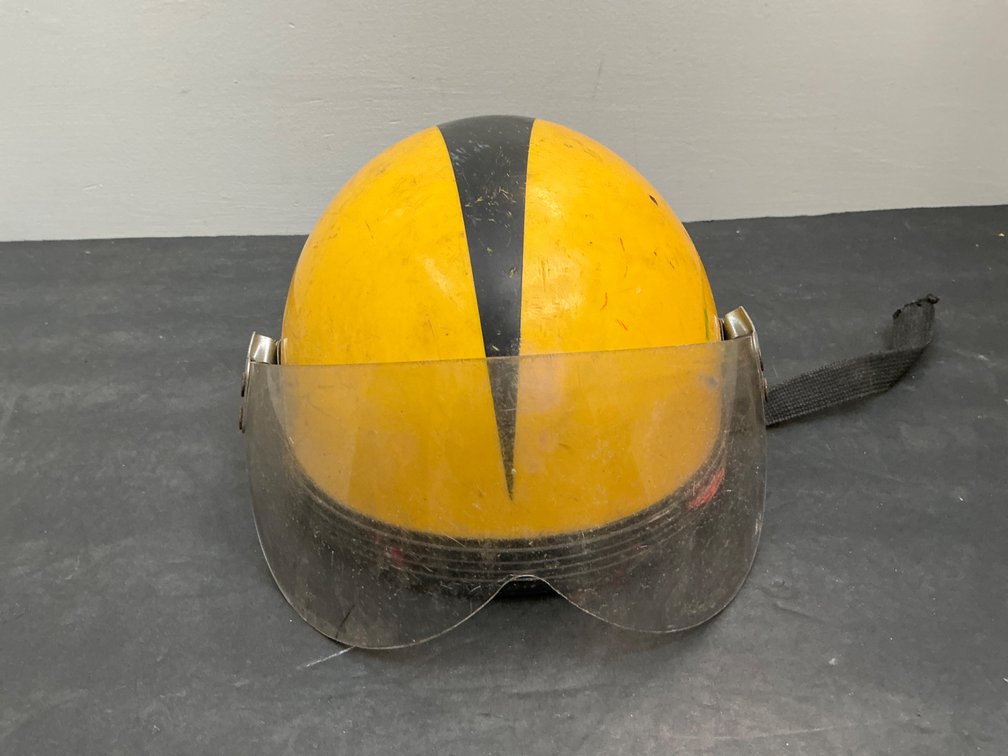 Yellow helmet with black stripe & clear visor