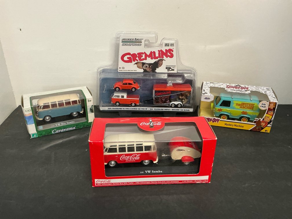 Grouping of 4 packaged die-cast vehicle models
