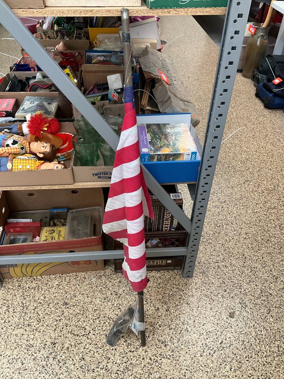 American flag on metal pole & ild compound bow