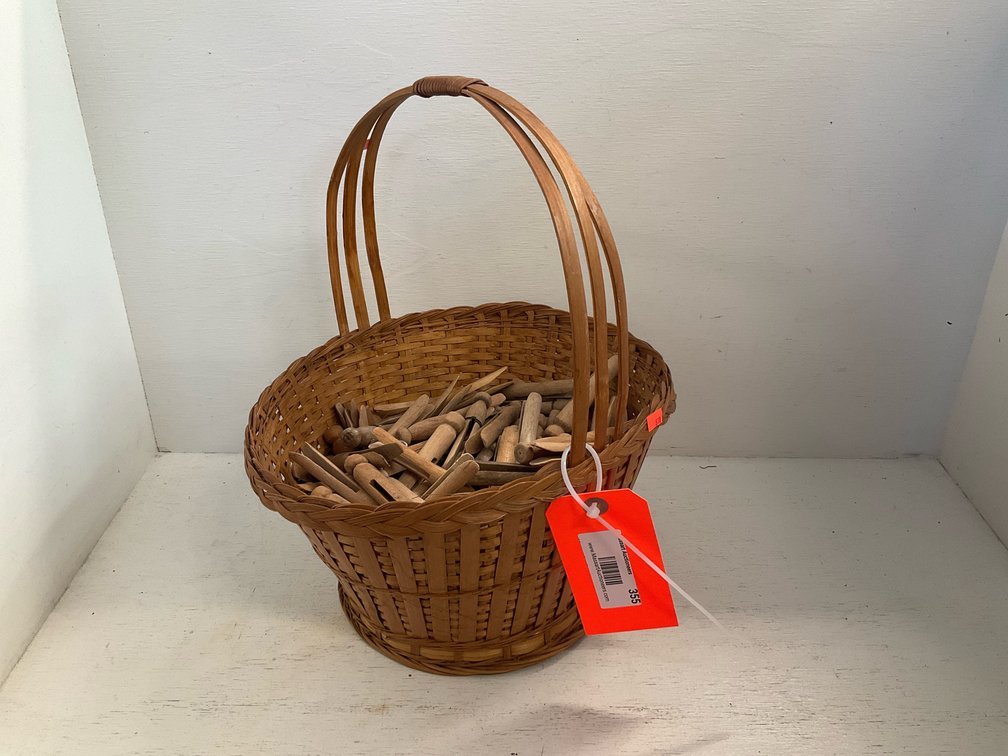 Woven splint basket with wooden peg clothespins