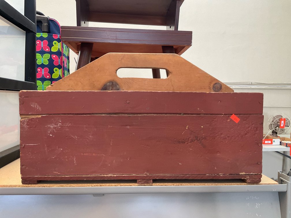 Red painted wooden tool tote with center handle