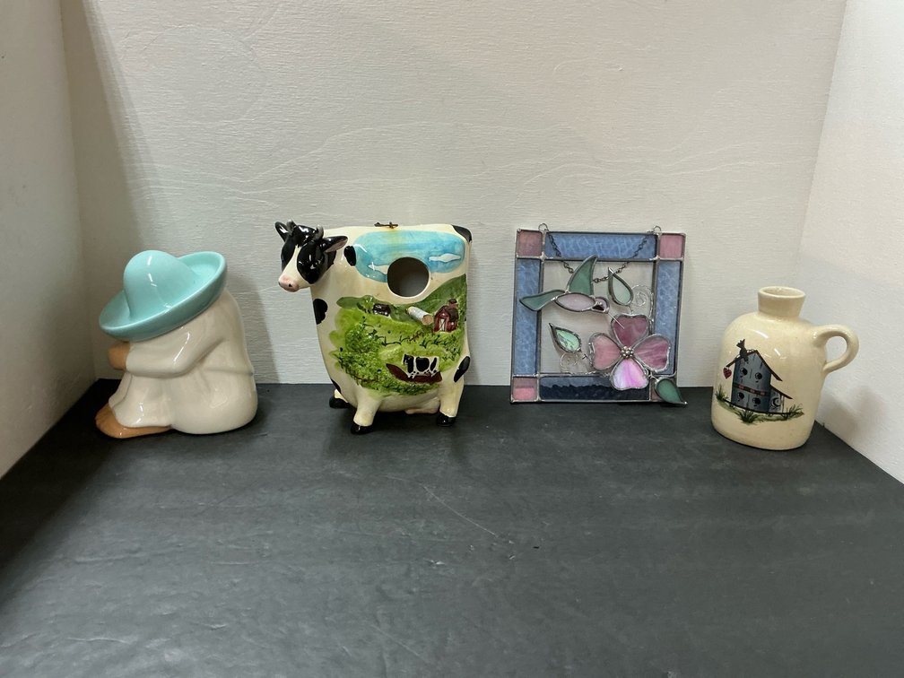 Grouping of decorative items with stained glass panel