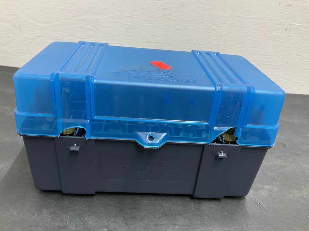 7mm Rem Mag rifle cartridges in plastic ammo box