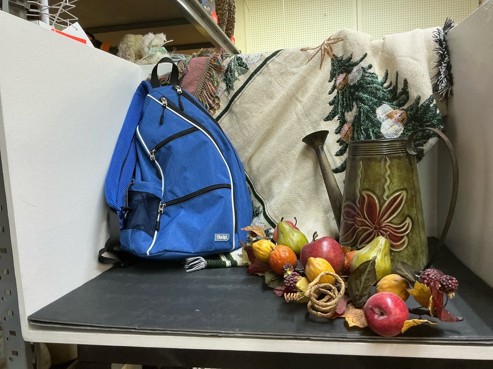 Grouping of sling backpack, Christmas throw blanket & decor