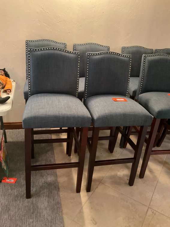 Blue upholstered barstools with nailhead trim - Basement Living & Bar Area