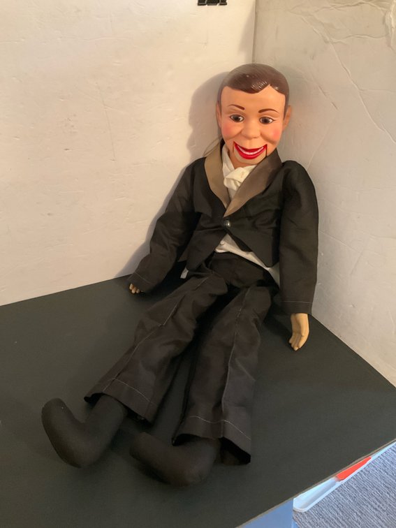 Juro Novelty Co. ventriloquist dummy in black tuxedo - Basement Living & Bar Area