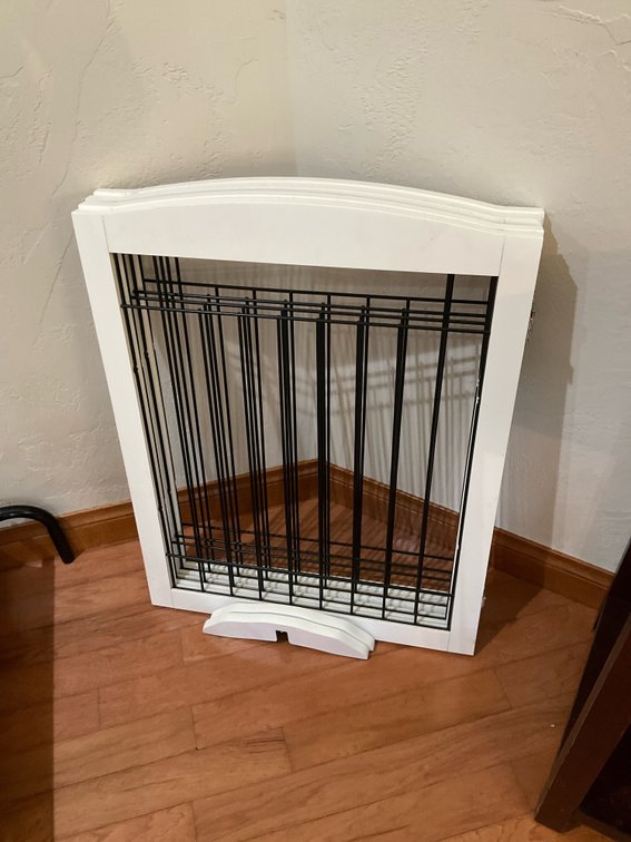 White folding pet gate with wire inserts - Hallway