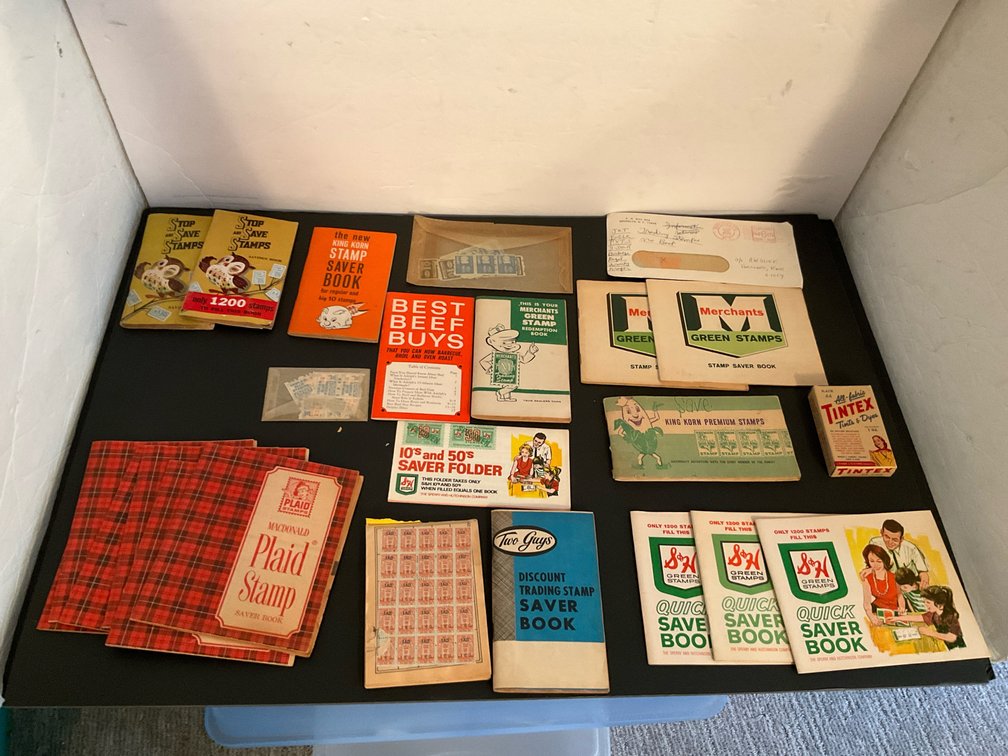 Grouping of trading stamp saver books & stamps - Basement Living & Bar Area