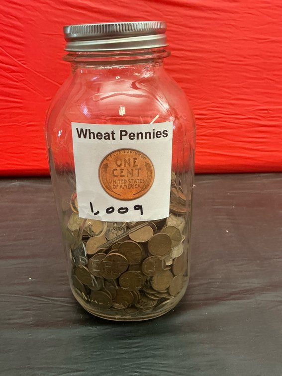 Approximately 1,009 wheat pennies in glass jar