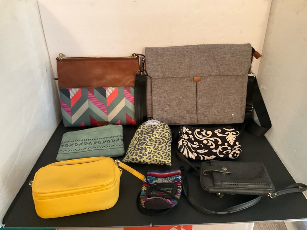 Grouping of handbags, crossbody bags & pouches - Basement Living & Bar Area