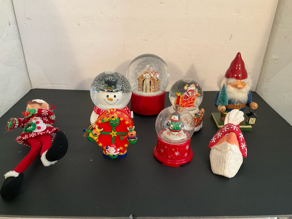 Holiday decorations with snow globes & figurines - Basement Living & Bar Area