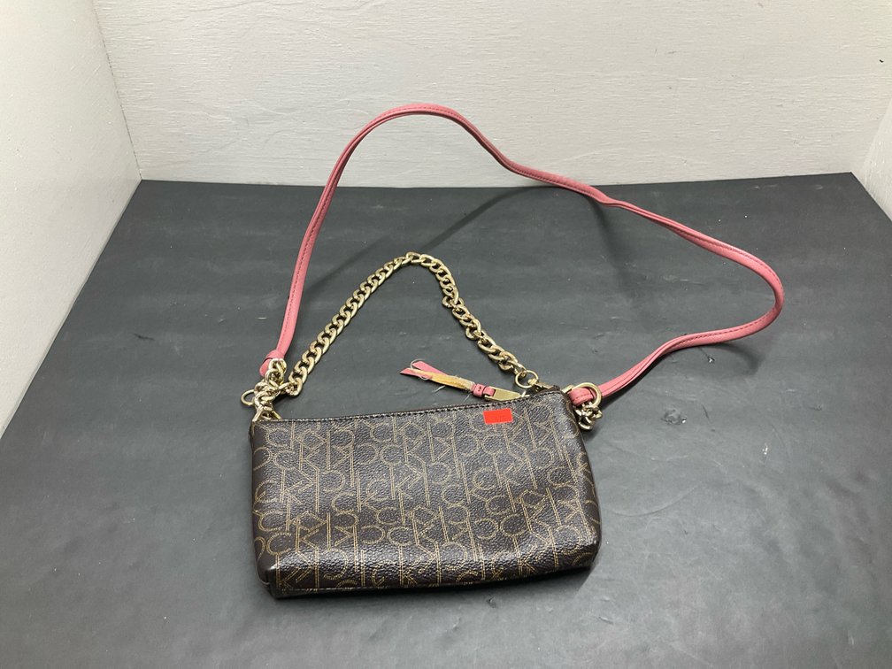 Calvin Klein monogram crossbody bag with pink strap