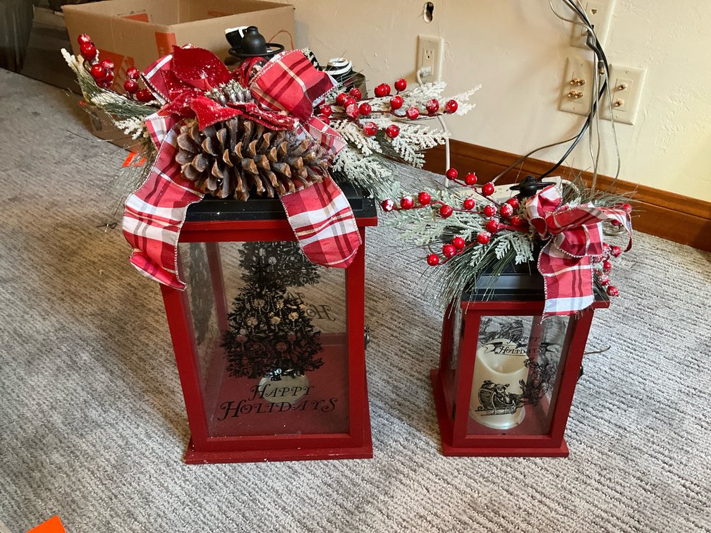 Pair of red holiday lanterns with frosted greenery - Basement Living & Bar Area