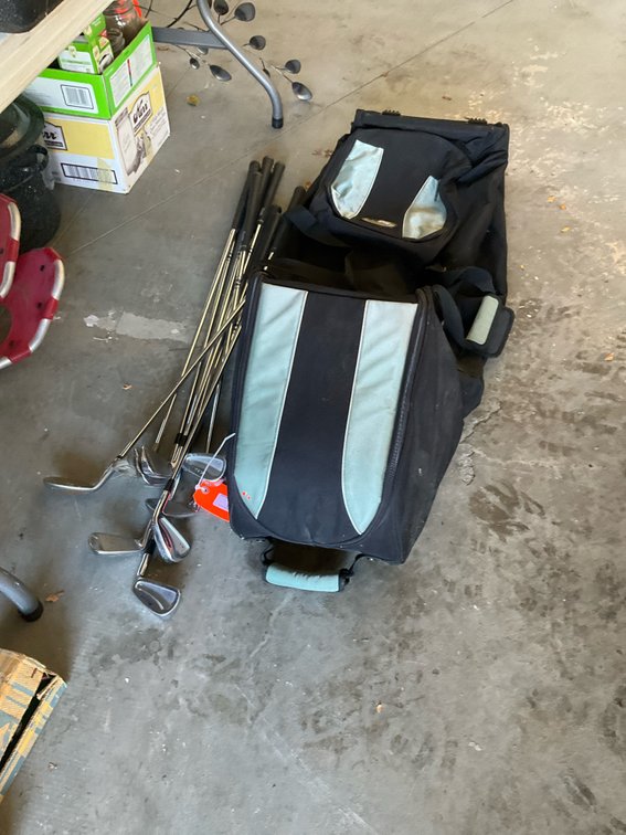 Assorted golf clubs & wheeled travel bag - Garage