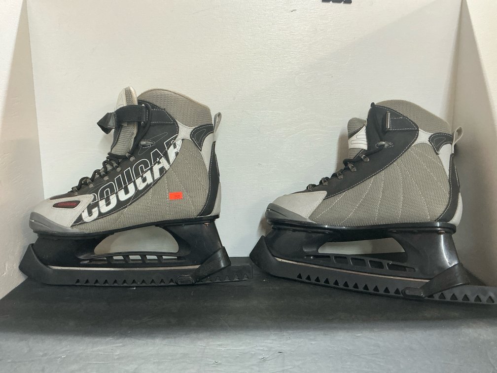 Pair of Cougar ice skates with blade guards