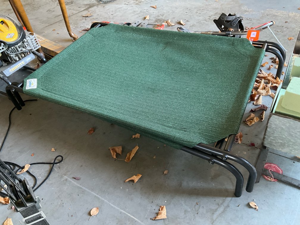 Pair of Coolaroo green elevated pet cots - Garage