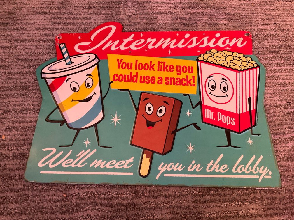 Open Road Brands Intermission embossed metal sign - Basement Living & Bar Area