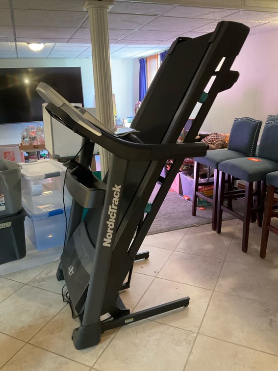 NordicTrack C 970 Pro folding treadmill - Basement Living & Bar Area