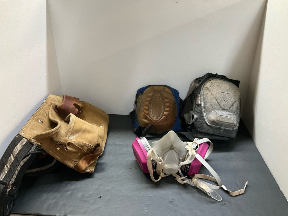 Grouping of tool pouch, respirator, & knee pads