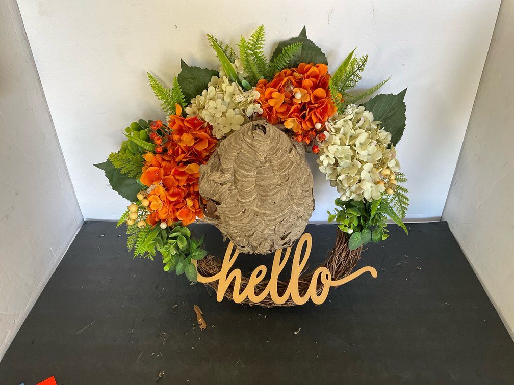 Grapevine floral wreath with hornet nest & "hello" sign - Garage