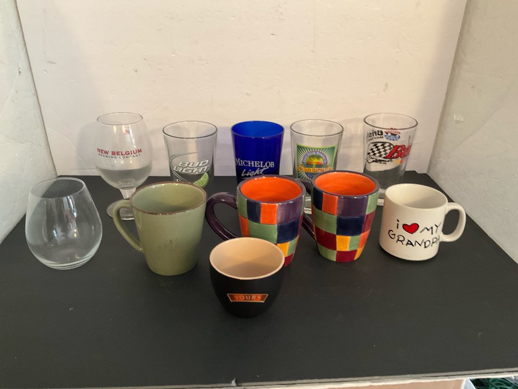 Assorted beer glasses & ceramic mugs - Basement Living & Bar Area