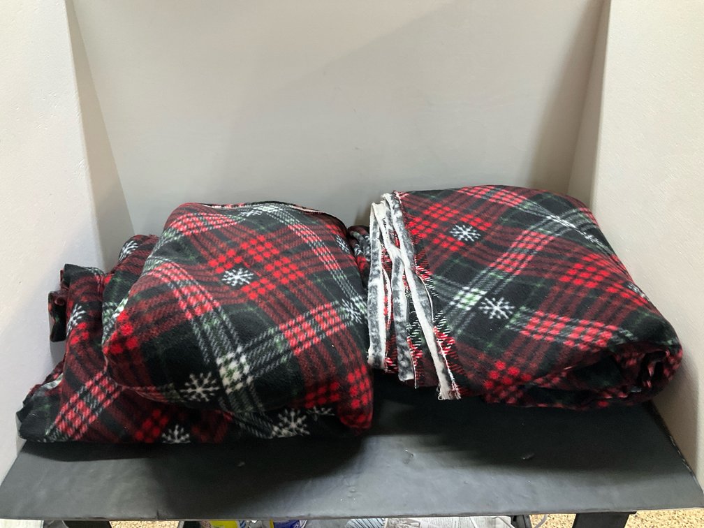 Red & green plaid fleece fabric with snowflake pattern