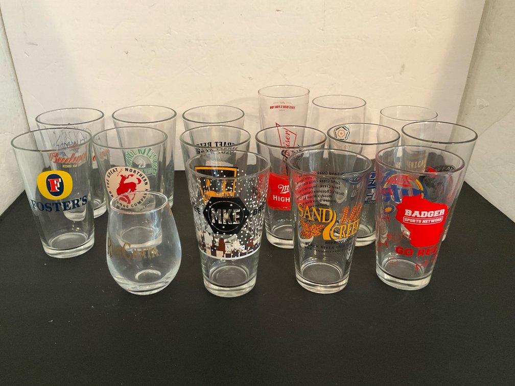 Grouping of assorted brewery & bar glasses - Basement Living & Bar Area