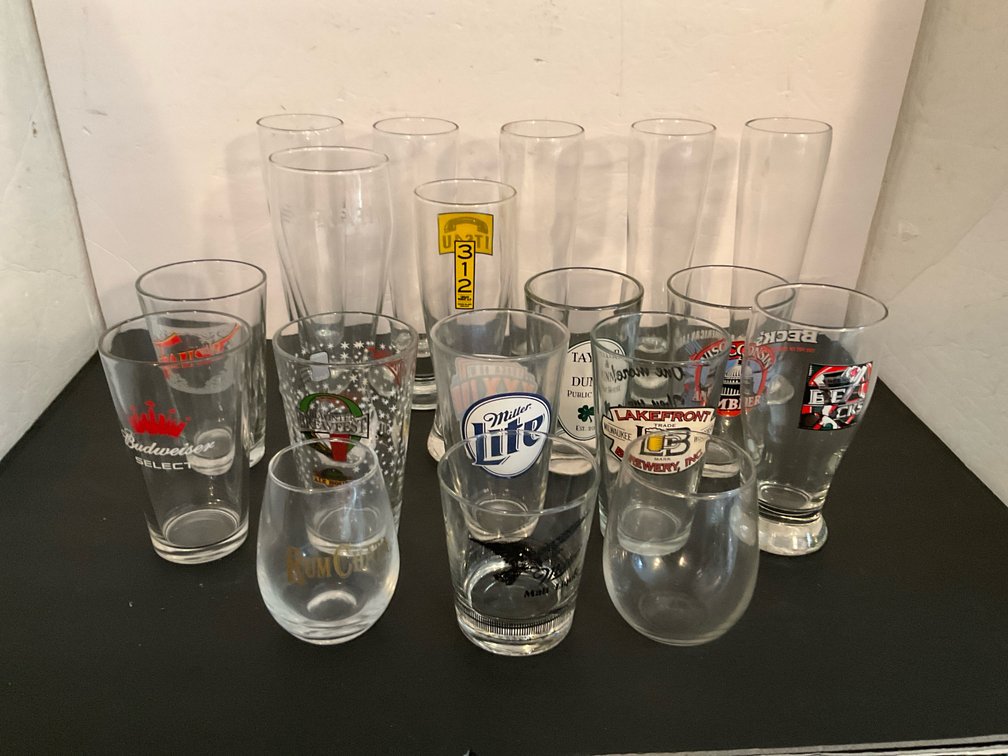 Grouping of assorted brewery & bar glasses - Basement Living & Bar Area