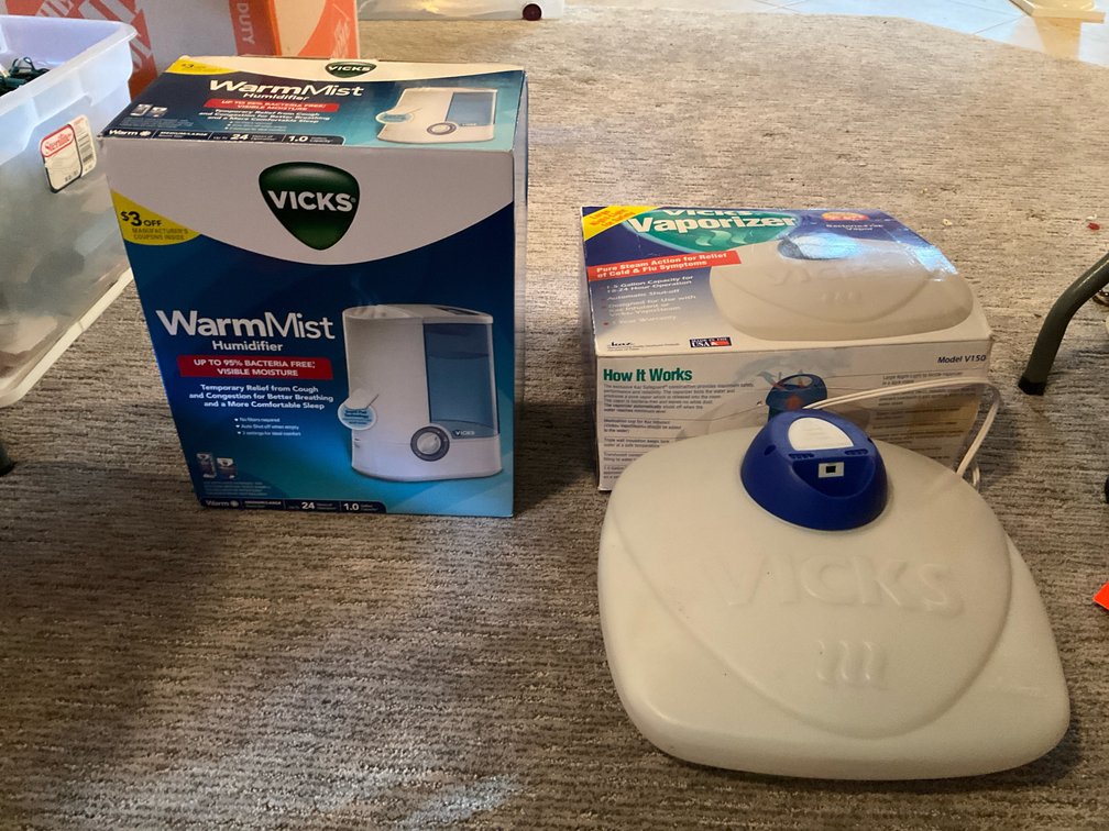Pair of Vicks warm mist humidifier & vaporizer - Basement Living & Bar Area
