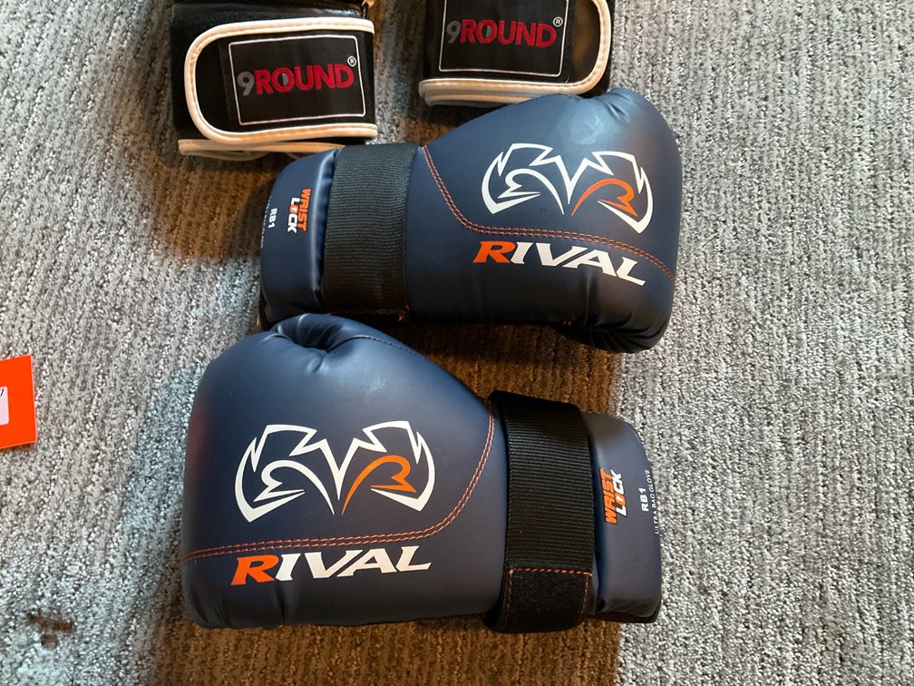 2 pairs of Rival & 9Round boxing gloves - Basement Living & Bar Area