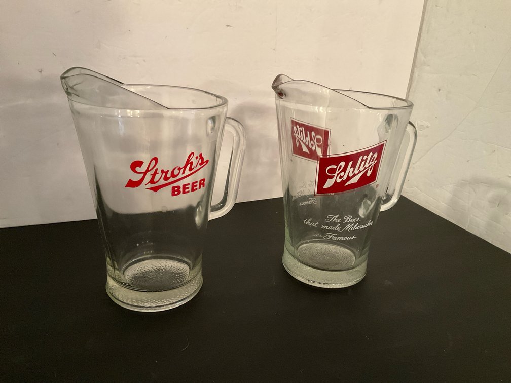 Pair of Stroh's & Schlitz glass beer pitchers - Basement Living & Bar Area